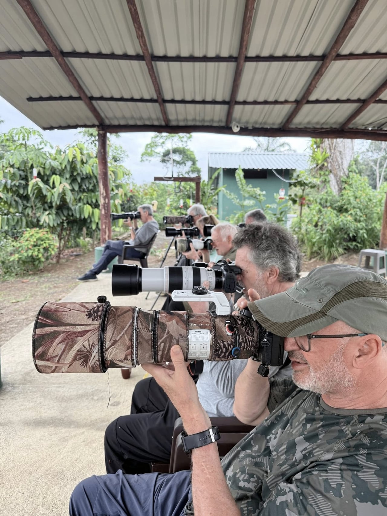 Photographers with telephoto lenses at the Boca Tapada hide